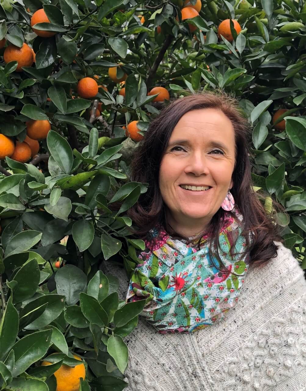 Beatrice Dean - German naturopath - next to orange tree, talks about Winter wellness